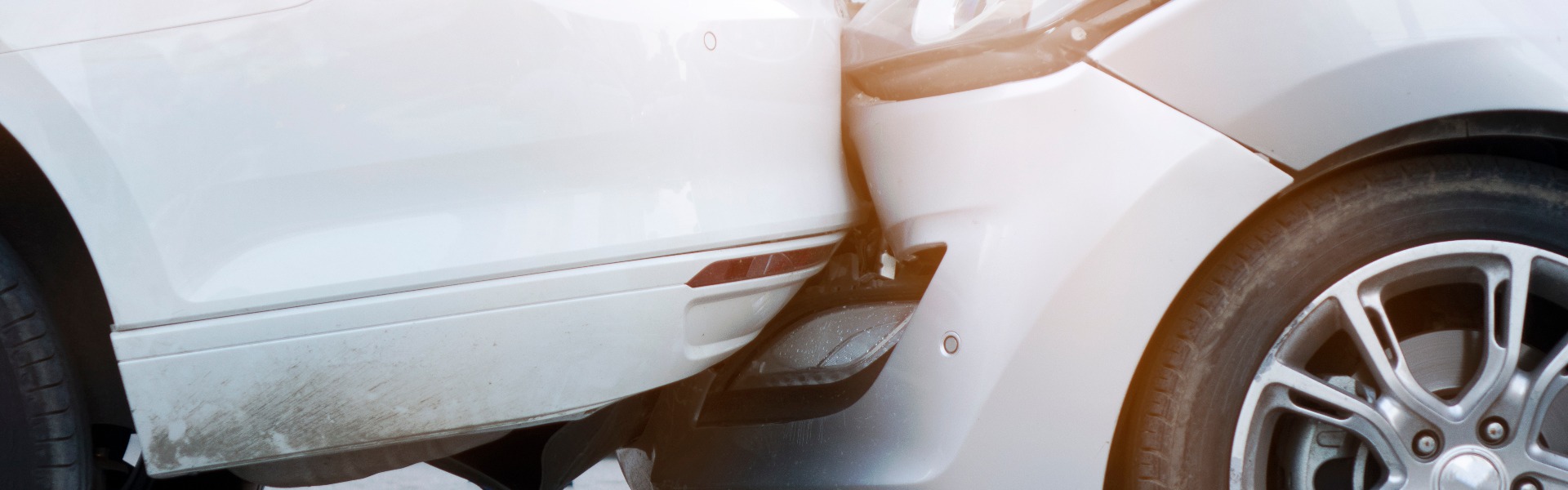 Auto accident involving two cars on a city street